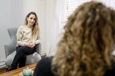 Female Psychologist Listening To Her Patient